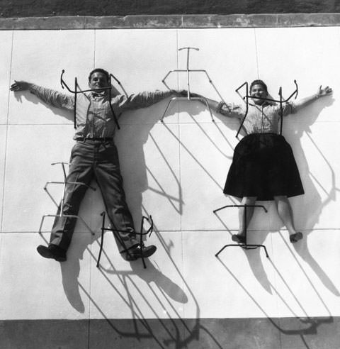 Charles and Ray Eames with DCM chair frames